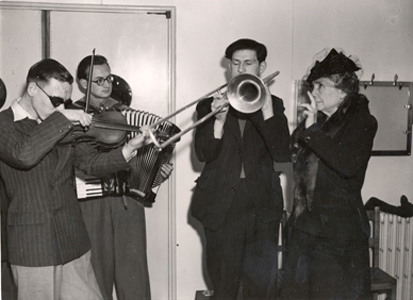 Helen Keller with musicians blinded while on active duty during World War II