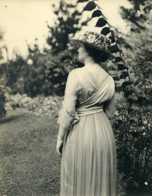 Helen Keller outdoors wearing gorgeous hat