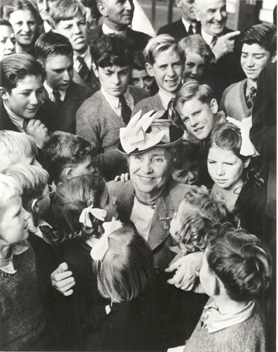 Helen Keller surrounded by school children. Australia 1948