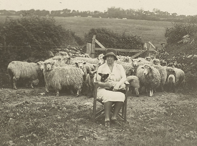 Helen Keller with sheep in Scotland.