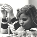 Close-up of young girl working on bead project