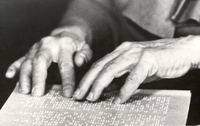 Helen's hands reading braille, 1933