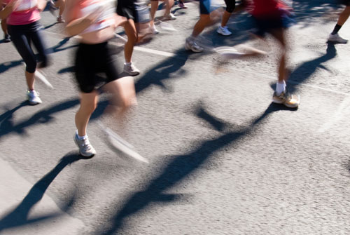 Crowd of marathon runners, with motion blur to accent speed.