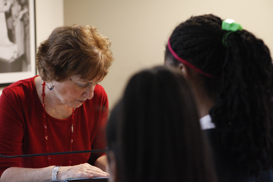 Author Doreen Rappaport signs books for students.