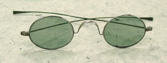 Saddle bridge spectacles with dark grey lenses such as these were typical of the kind of eyeglasses that Anne Sullivan would have worn. Photograph circa 1890/ Gift of L. Katzen, photo courtesy of the Museum of Vision, San Francisco, California.