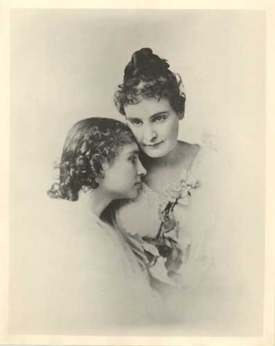 A formal portrait of Helen Keller and Anne Sullivan. Helen is about 15 years old.