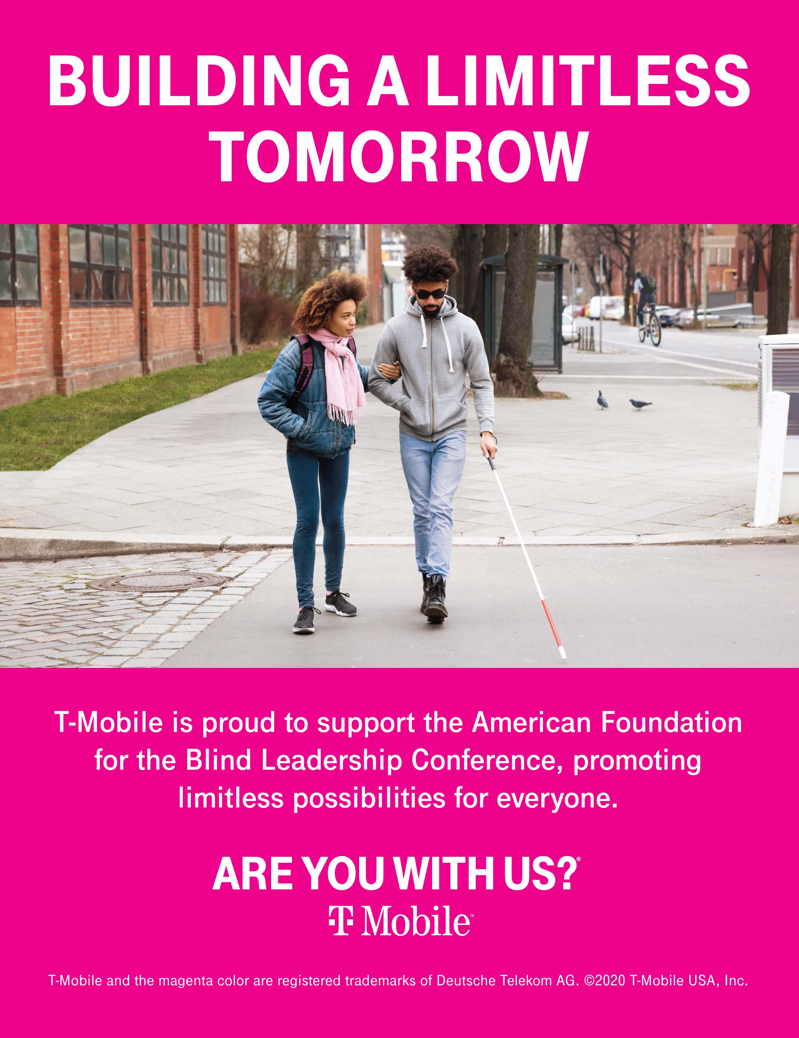 Image: A college-age black couple in conversation crosses a city street toward the camera. The woman holds the man's right elbow while he uses a white cane with his left hand. She wears a denim jacket, a backpack, and a pink scarf and black sneakers. He wears sunglasses, a grey hoodie, jeans and black lace-up boots.