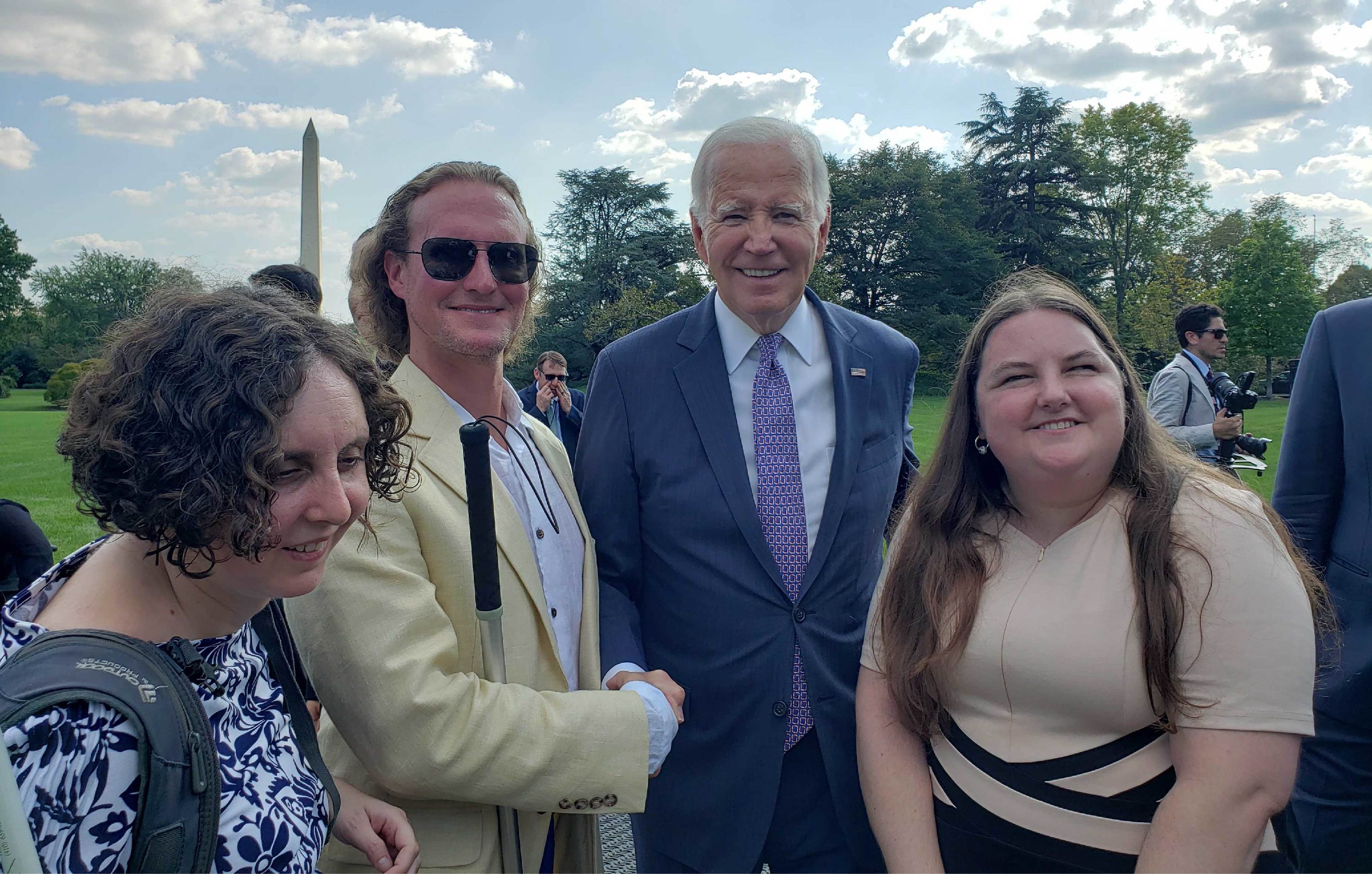 Dr. Arielle Silverman with President Biden and colleagues in front of Washington monument.