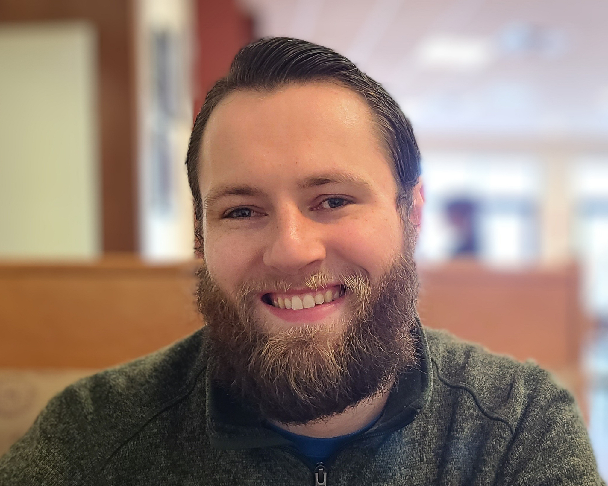William, a smiling man with short brown hair and a beard.