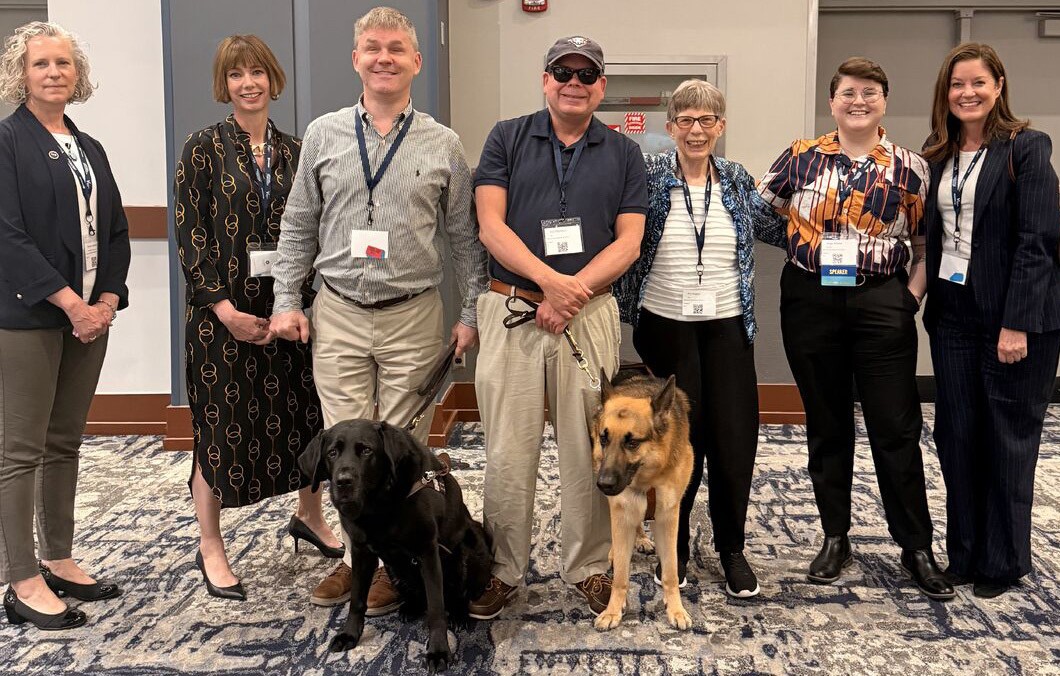 AFB staff and guide dogs gathered together.
