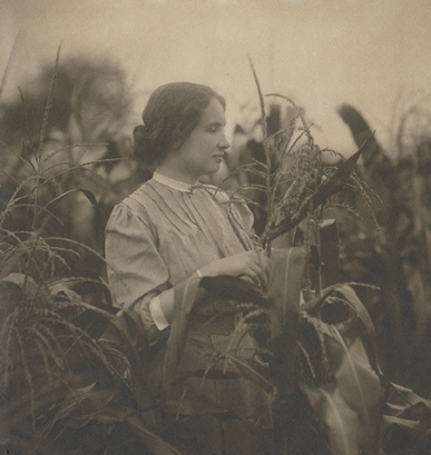 Helen Keller among cornstalks, circa 1910