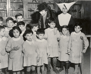 Helen visiting disabled, deaf, and blind children in post-war Rome, Italy, 1946