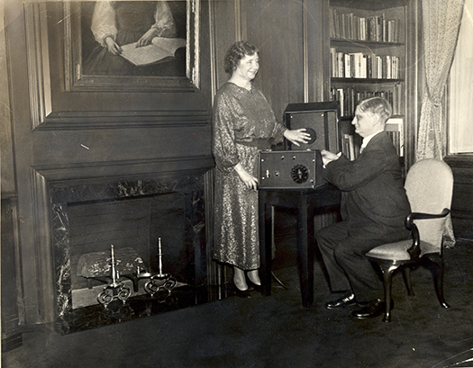 Helen Keller and Robert Irwin: Helen is touching a phonograph and smiling