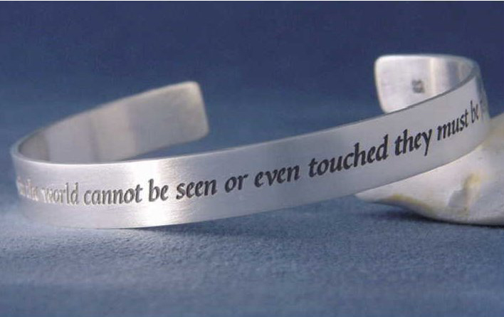 Helen Keller quotation on a silver bracelet