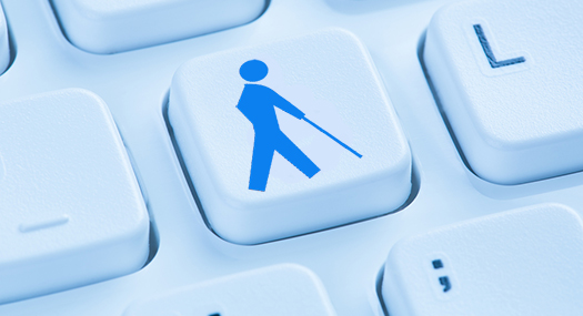 computer keyboard with one key depicting an icon of a person who is blind, walking with a long cane