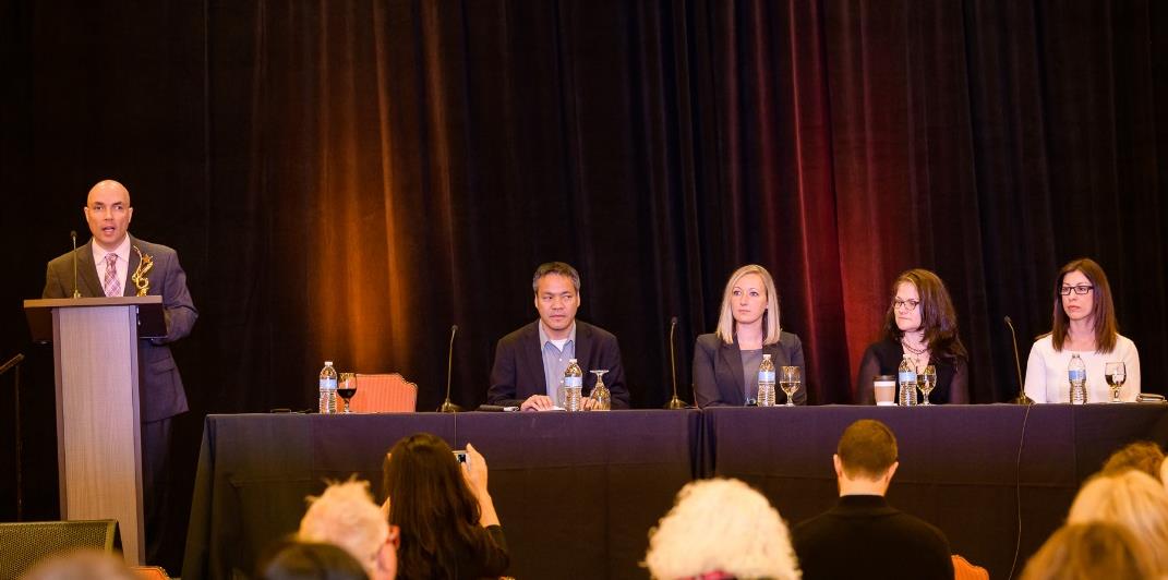 Russell Shaffer speaks while Jennison Asuncion, LinkedIn; Megan Mauney, Florida Blue; Jen Guadagno, Microsoft; and Dina Grilo, JPMorgan Chase & Co., look on.