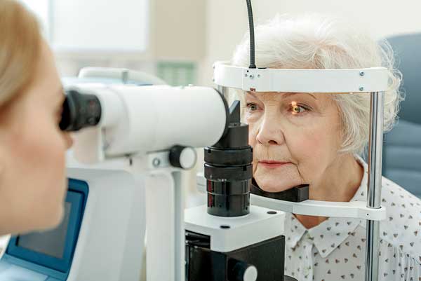 Senior woman getting an eye exam