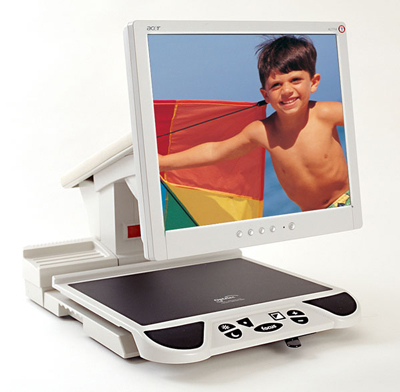 Photo of the ClearView Flat Panel CCTV showing nothing on the XY table but a bright color image of a boy with a kite on the screen.