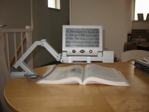 The STRIX on a stand reading a textbook.