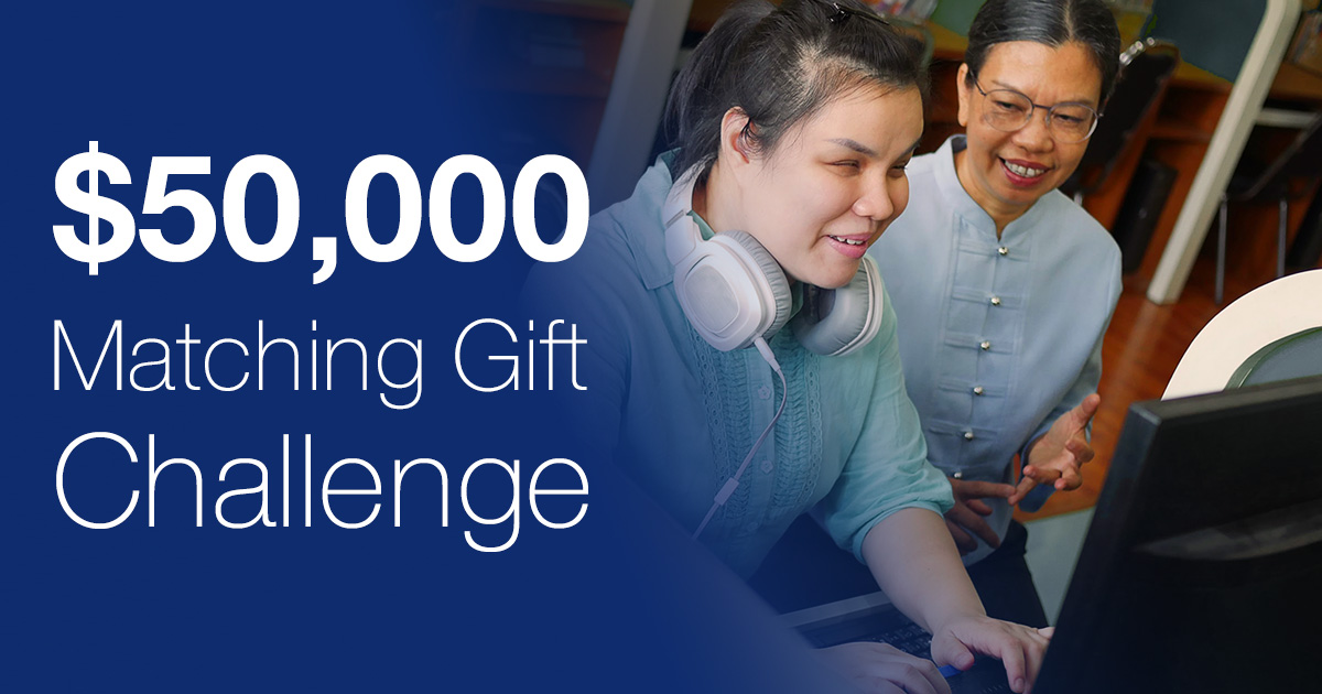 Two women are smiling in front of the computer. Next to the two women is the text, “$50,000 Matching gift challenge”. 
